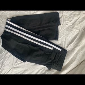 Black jeans, white stripes.